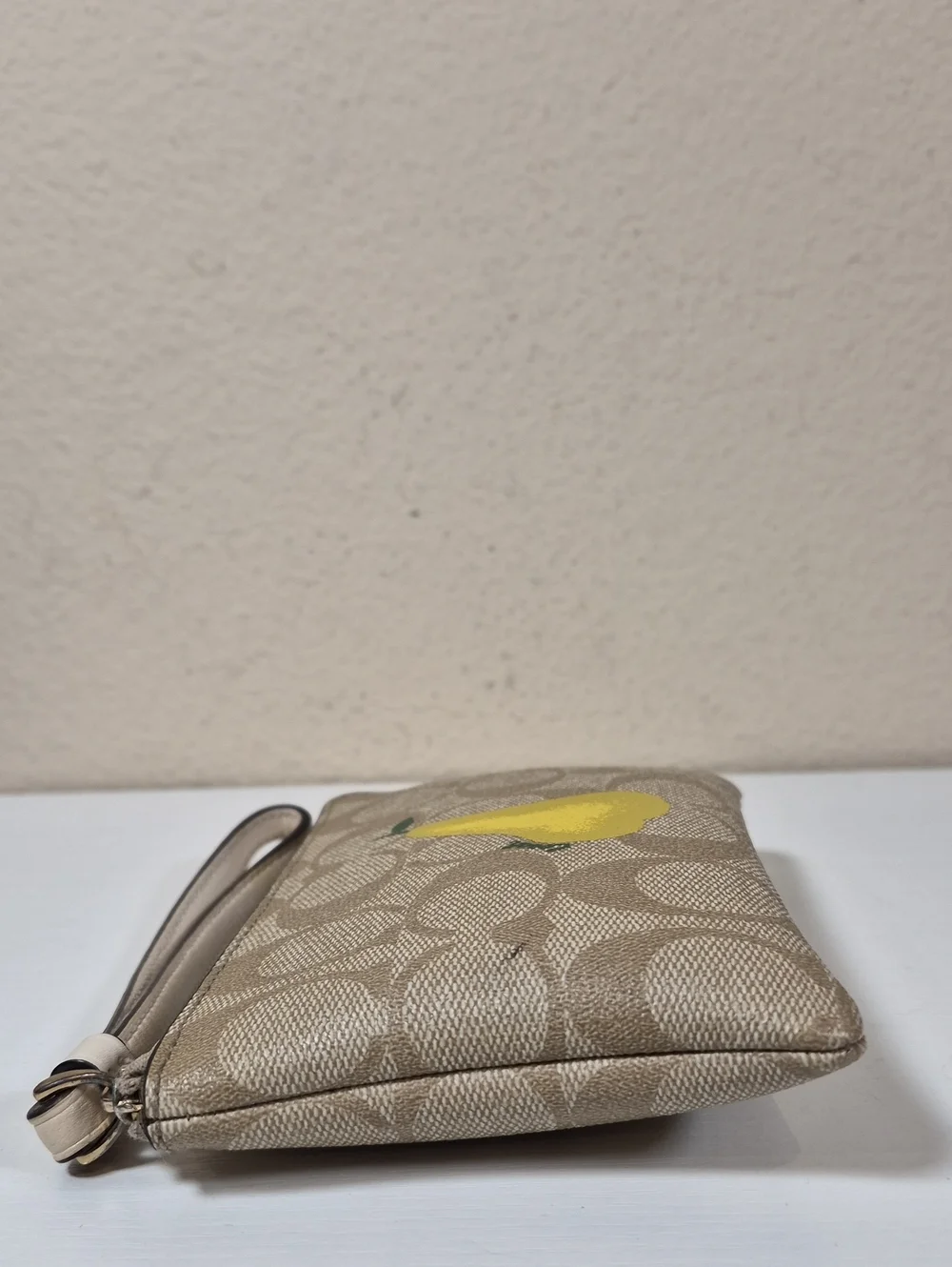 Coach Corner Zip Wristlet In Signature Canvas With Pear